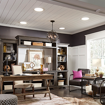 A home office is illuminated by natural daylight thanks to four VELUX Sun Tunnel® Skylights in the ceiling.